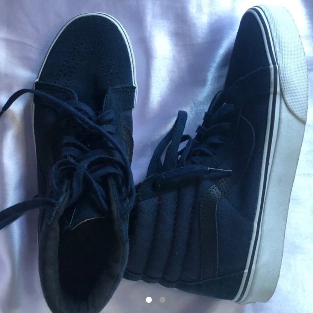 Blue and black high top Vans